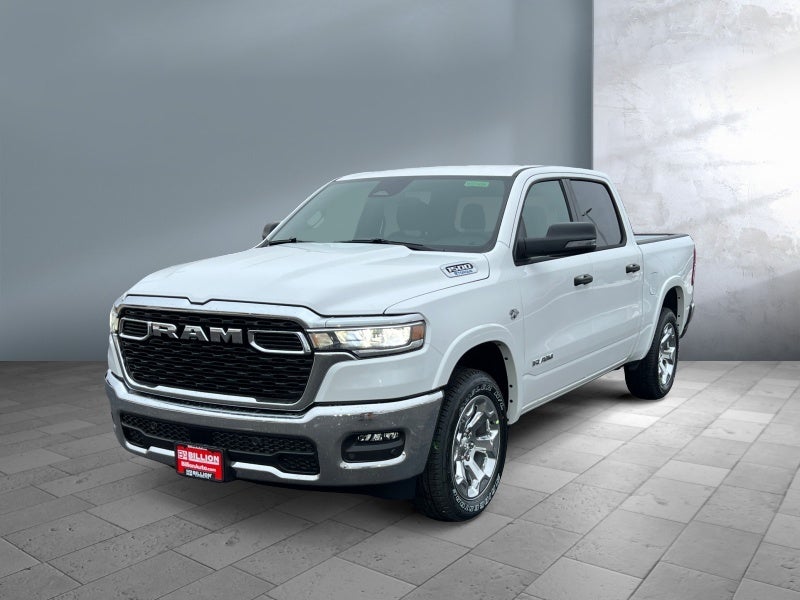 2026 RAM Ram 1500 RAM 1500 BIG HORN CREW CAB 4X4 5'7' BOX in Bright White Clear-Coat Exterior Paint — front three-quarter view